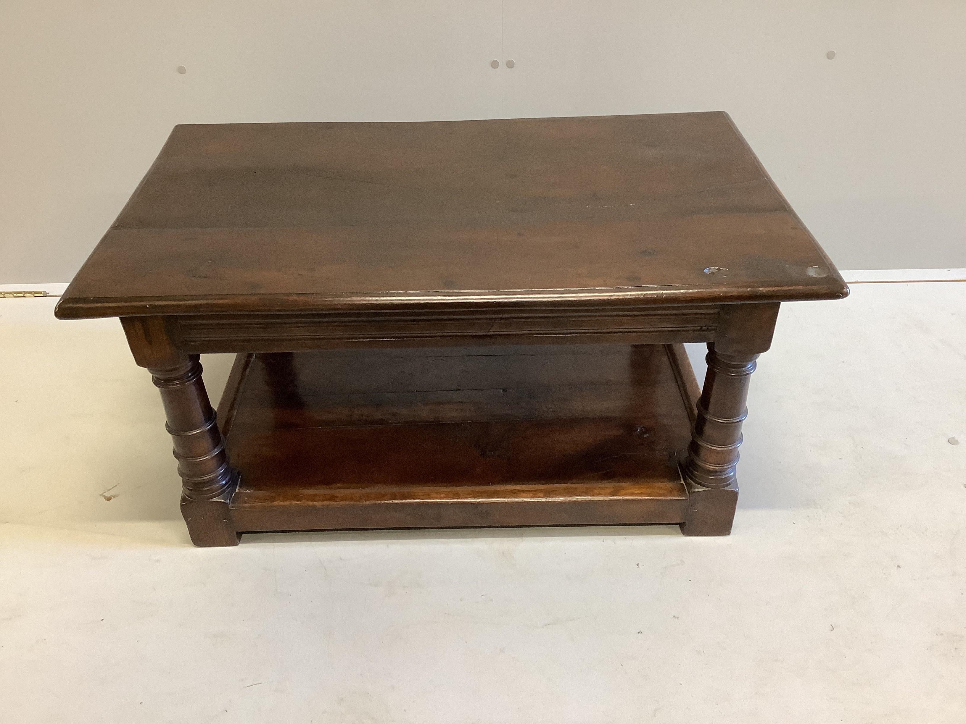 An 18th century style rectangular oak two tier coffee table, width 91cm, depth 56cm, height 42cm